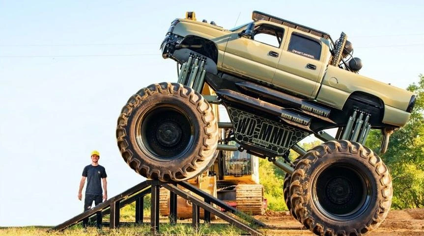 Cody Detwiler building oversized Monster Max 2 diesel truck in workshop.