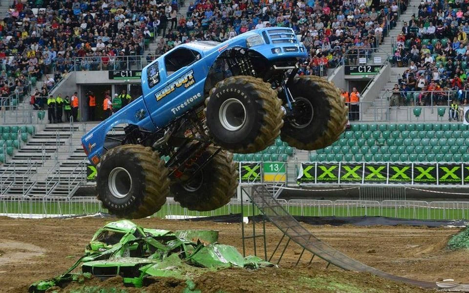 Monster Jam arena truck compared with oversized Monster Max 2 off-road build.